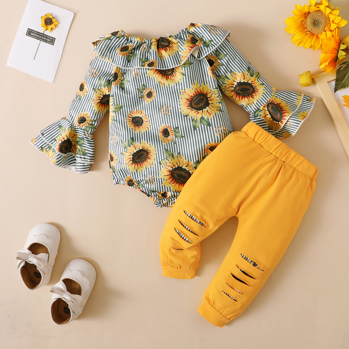 2pcs Baby Girl 95% Cotton Ripped Pants and Allover Sunflower Print Pinstriped Ruffle Trim Flare-sleeve Romper Set