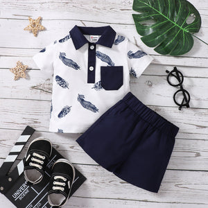 2pcs Baby Boy 100% Cotton Solid Shorts and Allover Feather Print Contrast Collar Short-sleeve Polo Shirt Set